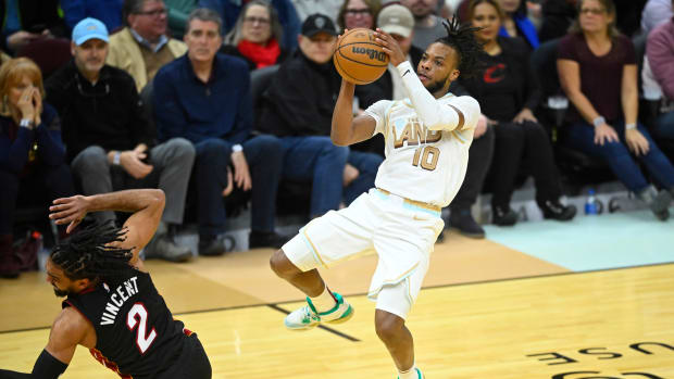 Cleveland Cavaliers guard Darius Garland (10) shoots beside Miami Heat guard Gabe Vincent (2) in the fourth quarter at Rocket Mortgage FieldHouse.